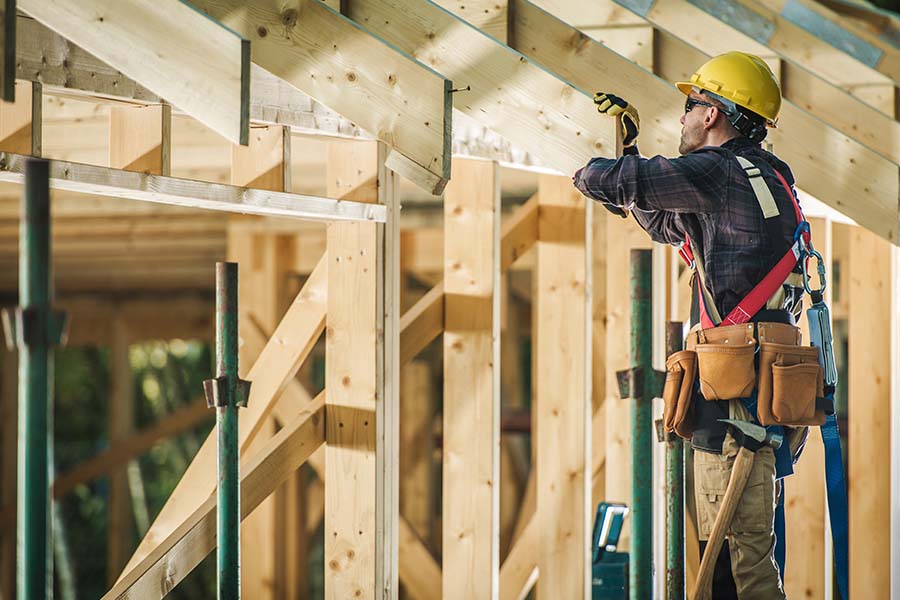 Construction worker framing house structure