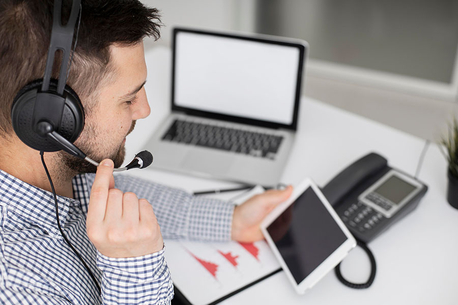 Man answering support call with headset