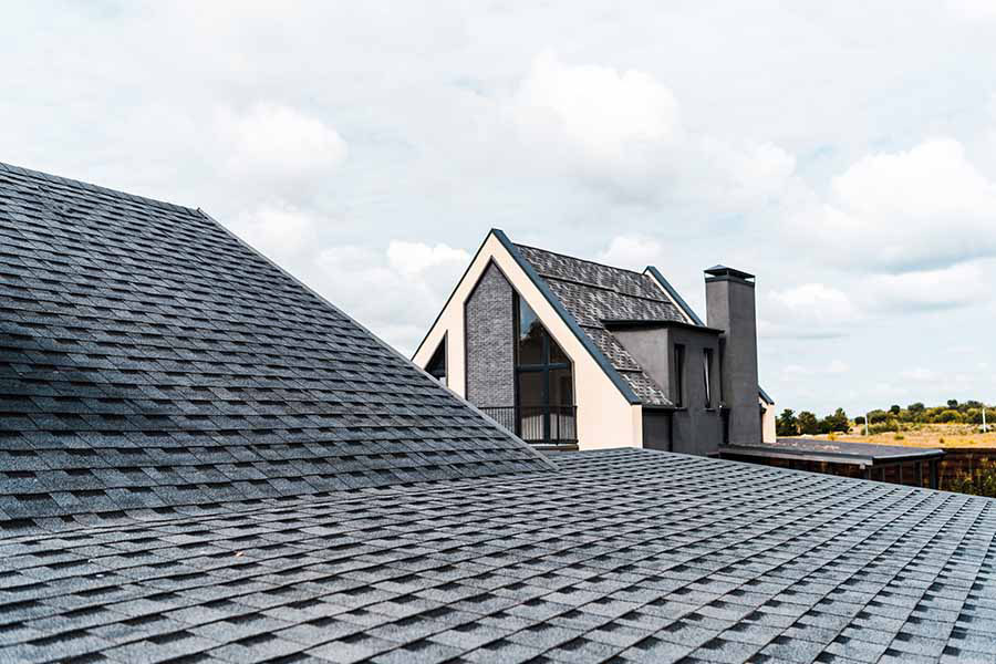 House with new shingle roofing