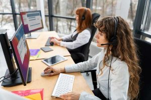 24/7 answering service agents handling business calls at computer workstations